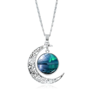 Detail of hollow moon pendant featuring aurora borealis pattern on silver chain