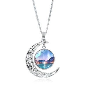 Silver hollow moon pendant necklace featuring northern lights landscape and glass dome charm