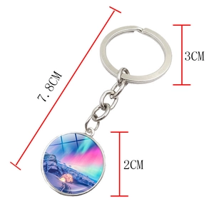 Aurora glass dome keychain with 7.8cm total length and 2cm circular pendant charm