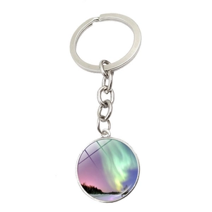 Silver aurora borealis keychain with glass dome showing scenic polar lights landscape