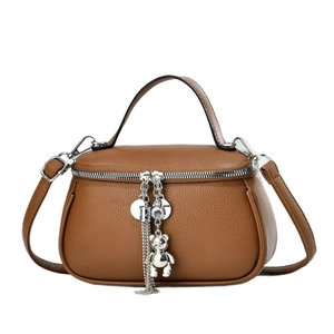 Brown litchi leather handbag with bear charm pendant and detachable shoulder strap