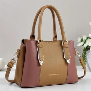 Close-up of litchi texture synthetic leather stitching and gold metal buckle details