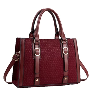 Burgundy minimalist color-block handbag with herringbone fabric and golden hardware