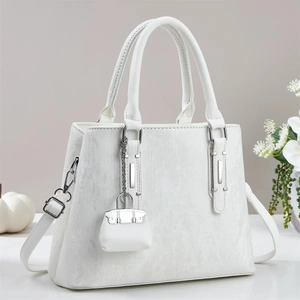 Elegant white striped texture handbag with silver hardware and mini charm accessory