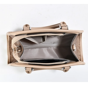 Top view of khaki handbag interior with chevron fabric lining and organized pockets