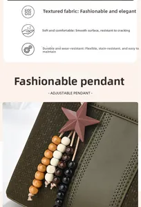 Detail of olive green PU leather handbag featuring grainy texture and beaded star pendant