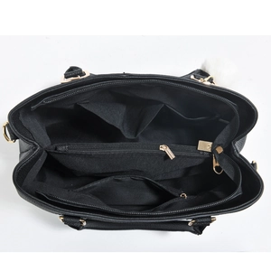 Top view of black leather tote bag showing multi-compartment interior and gold hardware