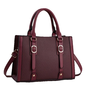 Elegant burgundy tote bag with woven texture and gold hardware for women's daily commute