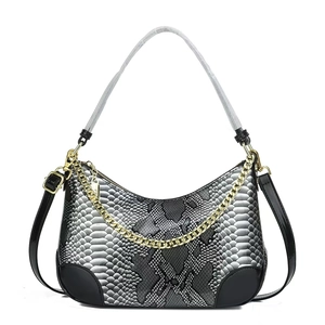 Snake pattern women's shoulder bag with gold chain and gray strap on white background