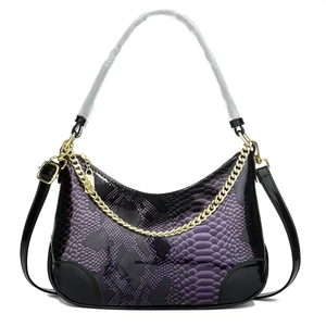 Detail of purple snakeskin pattern shoulder bag with glossy leather and gold chain