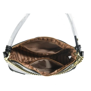 Interior view of black faux-snakeskin handbag with striped lining and zipper pocket