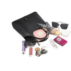 Black pebbled leather bucket bag with spacious interior for phone, umbrella and cosmetics