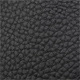 Close-up of black lychee grain leather texture on a bucket bag with premium finish