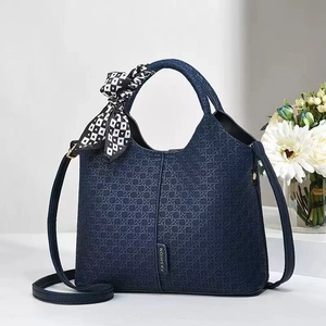 Dark blue woven bucket bag with silk scarf handle and detachable shoulder strap