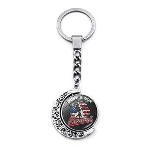 Silver US flag baseball spinner keychain featuring a baseball player silhouette design