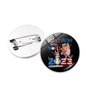 Close-up of baseball-themed brooch showing the metal pin back and 'Best Big Brother' design