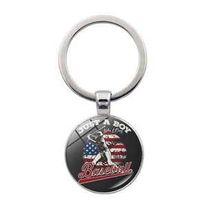 Macro detail of USA flag baseball keychain with Just A Boy Who Loves Baseball slogan