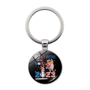 Macro detail of silver baseball keychain pendant with Best Big Brother 2023 design