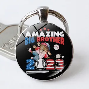Close-up of baseball keychain with Amazing Big Brother dog design and US flag colors