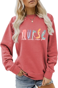 Detail of brick red nurse sweatshirt showing colorful print and high-quality cotton fabric