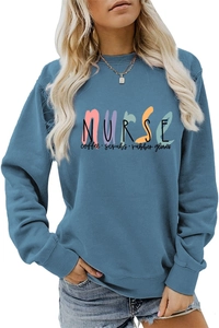 Detail of blue sweatshirt showing nurse-themed graphic and ribbed cuff texture