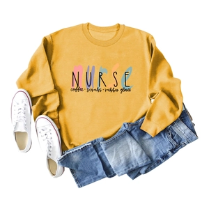 Nurse coffee scrubs print sweatshirt in ginger yellow with ribbed crewneck design