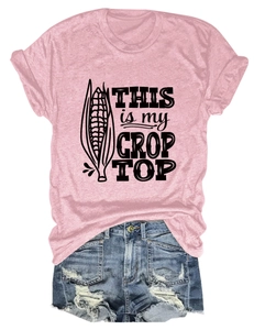 Pink crop top T-shirt with corn graphic and funny text paired with denim shorts