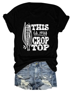 Flat lay of black cotton t-shirt with corn graphic and distressed denim shorts set