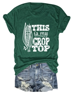 Detailed flat lay of a dark green cropped t-shirt featuring 'This Is My Crop Top' print