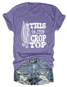 Detail of crop top with corn graphic and distressed denim shorts with ripped edges