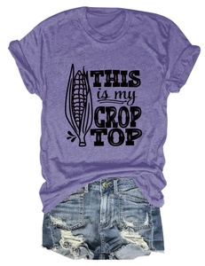 Flat lay of purple 'THIS IS MY CROP TOP' tee with distressed blue denim shorts set