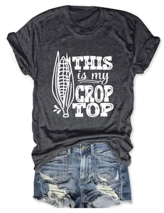 Flat lay of dark gray 'THIS IS MY CROP TOP' graphic tee and distressed denim shorts