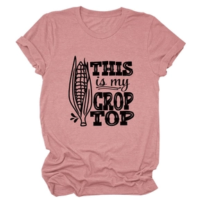 Detailed view of the 'THIS IS MY CROP TOP' corn print on soft pink cotton fabric
