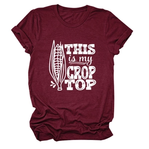 Detail of wine red crop top with white screen-printed corn design and funny text