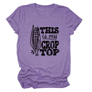 Detail of purple crop top featuring a pun corn graphic and THIS IS MY CROP TOP text