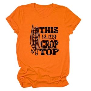 Flat lay of an orange cotton t-shirt with This is my Crop Top text and corn graphics