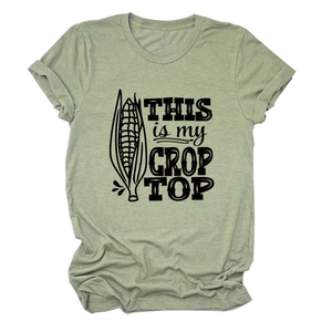 Detail of crop top print and grass green cotton fabric on summer crew neck t-shirt
