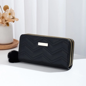 Black long double zipper wallet with wave quilting and furry ball charm on white background