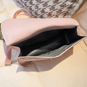 Pink quilted leather backpack with metal magnetic closure and spacious black interior