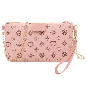Pink monogram clutch bag with golden chain and wrist strap for women