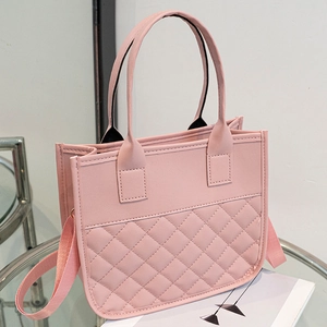 Chic lotus pink quilted tote bag with dual handles and adjustable shoulder strap