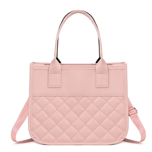 Pink quilted shoulder bag with top handles and adjustable strap on white background