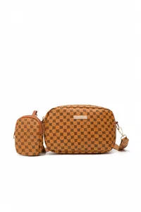 Detail of retro brown crossbody camera bag with geometric floral pattern and round coin purse