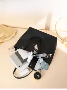 Top view of spacious black tote bag with silk scarf showing large capacity for essentials