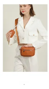 Detail of caramel brown crossbody bag set with wide nylon strap and mini pouch