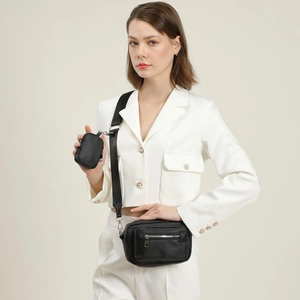 Minimalist black crossbody bag set with small round coin purse on fabric shoulder strap