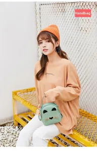 Mint green mini cat-shaped backpack with cute ears and metal whiskers detail
