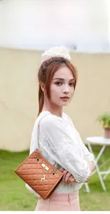 Brown quilted chain shoulder bag with cute deer pendant and diamond pattern detail