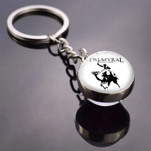 Close-up of Palmyra Camel Rider glass cabochon keychain with silver metal and reflection