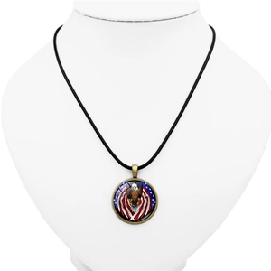 Patriotic eagle US flag pendant necklace with black cord on white jewelry display stand